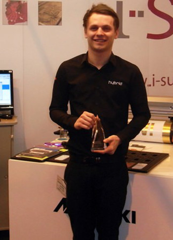 Hybrid’s Sam Mitchell with the Trophex award for Most Pioneering Product – won by the Mimaki UJF-6042